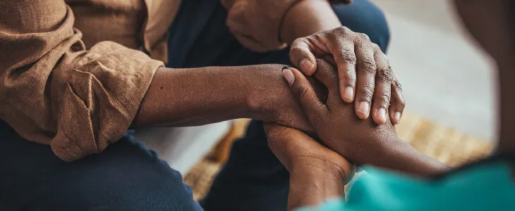 two people holding each others hands mental health law