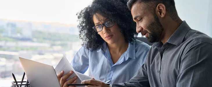 male and female couple looking at a tablet trusts and estate planning